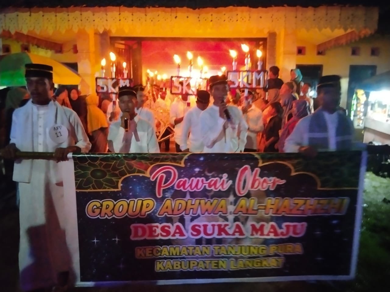 Polres Langkat Laksanakan Pengamanan Kegiatan Festival Pawai Obor Kreatif Patuah ke-5 & Sekaligus Milad ke- 6 di Tanjung Pura