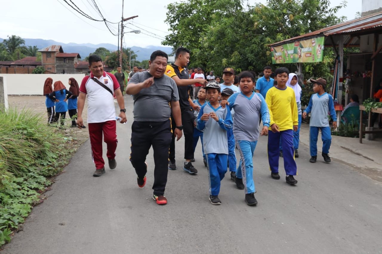 Sambut HUT RI Ke-79, Kapolres Palas Hadiri Gerak Jalan Santai